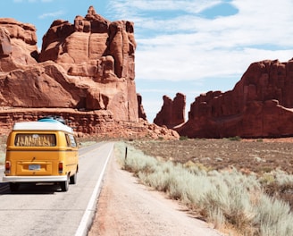 yellow Volkswagen van on road