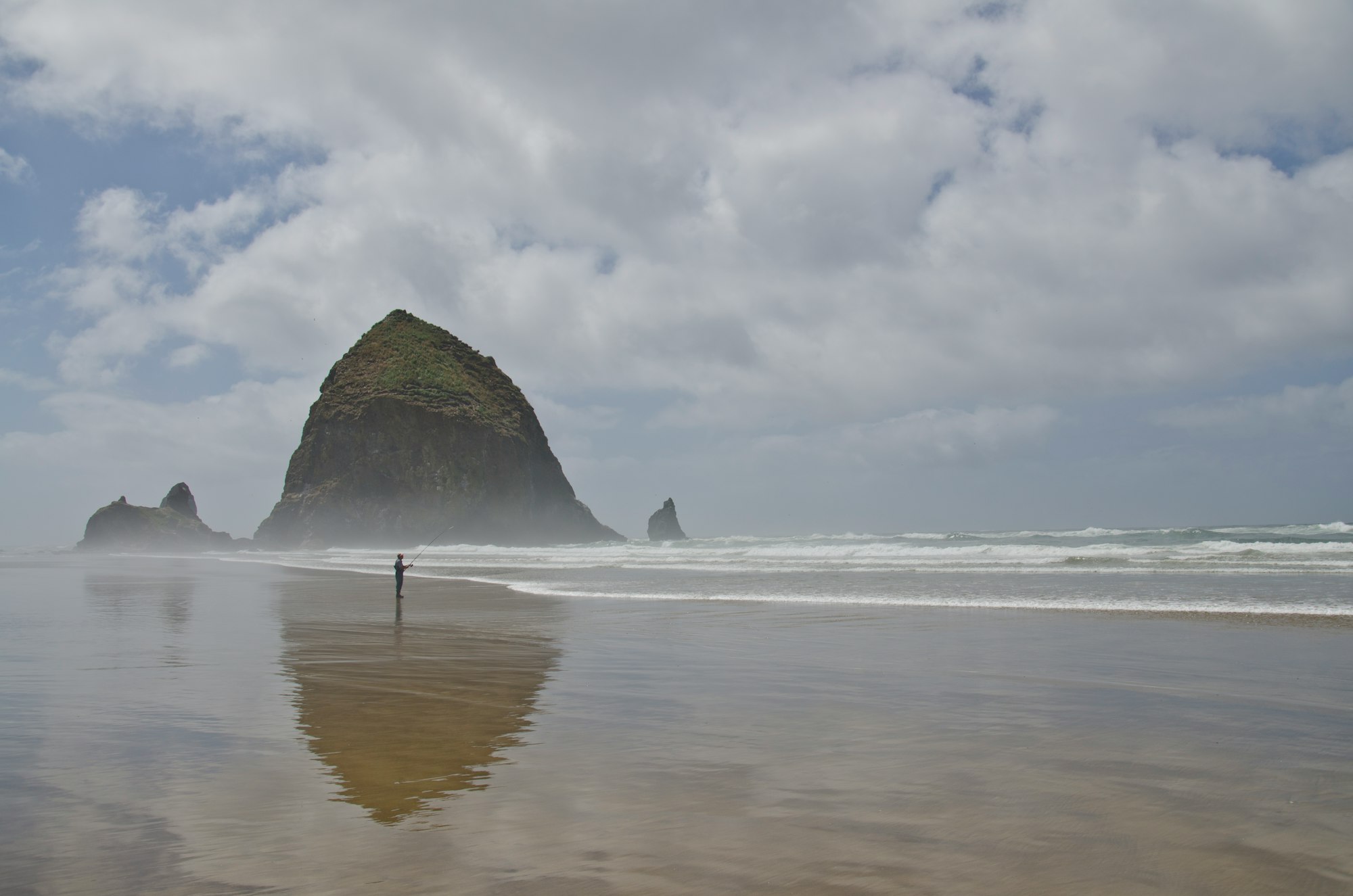 Person fishing on Cannon Beach