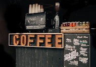 brown coffee signage beside poster