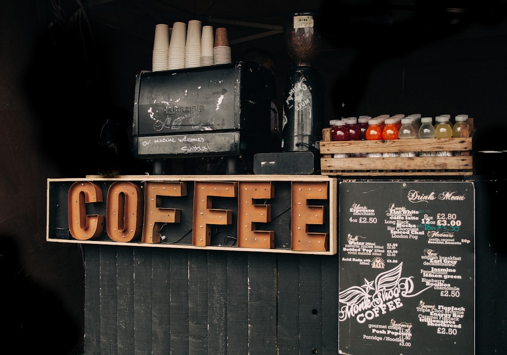 brown coffee signage beside poster