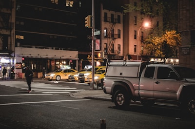 Quiet street scene in Potsdam with a premium taxi parked nearby under soft evening light.