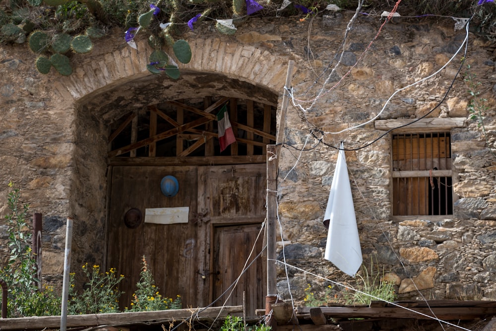 white umbrella on brown wooden door