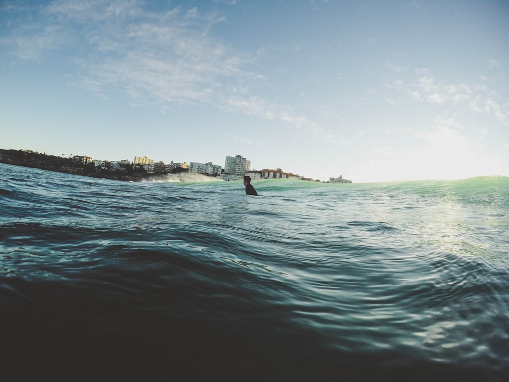 man on body of water during daytime