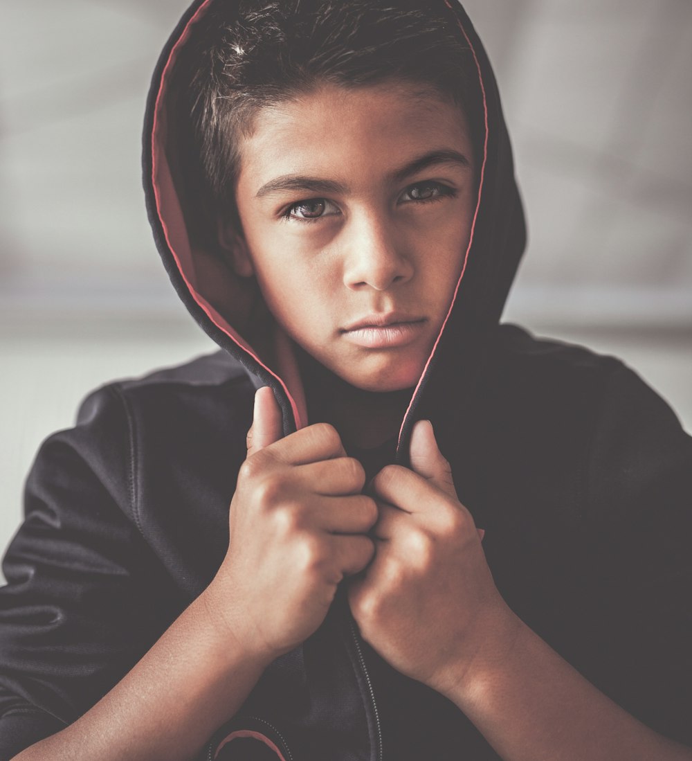 boy in black hoodie