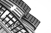 Asymmetrical layout featuring bold geometric shapes and thick dividing lines.