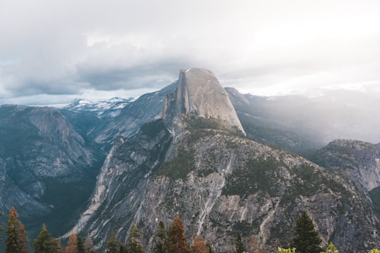 photo of gray mountain under white clouds at daytime in Yosemite National Park United States
