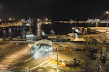 The bustling port of Buenos Aires at sunset with ships and lively waterfront activity.