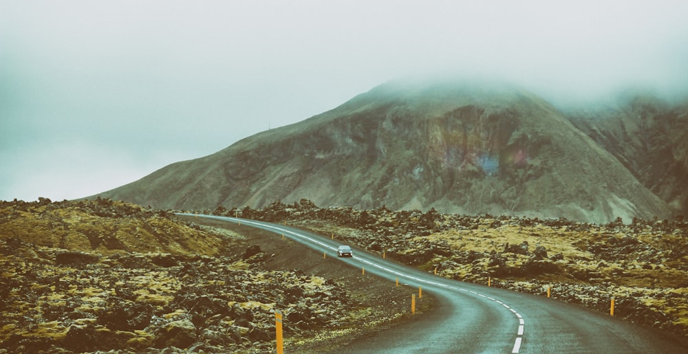 landscape photography of road between mountains