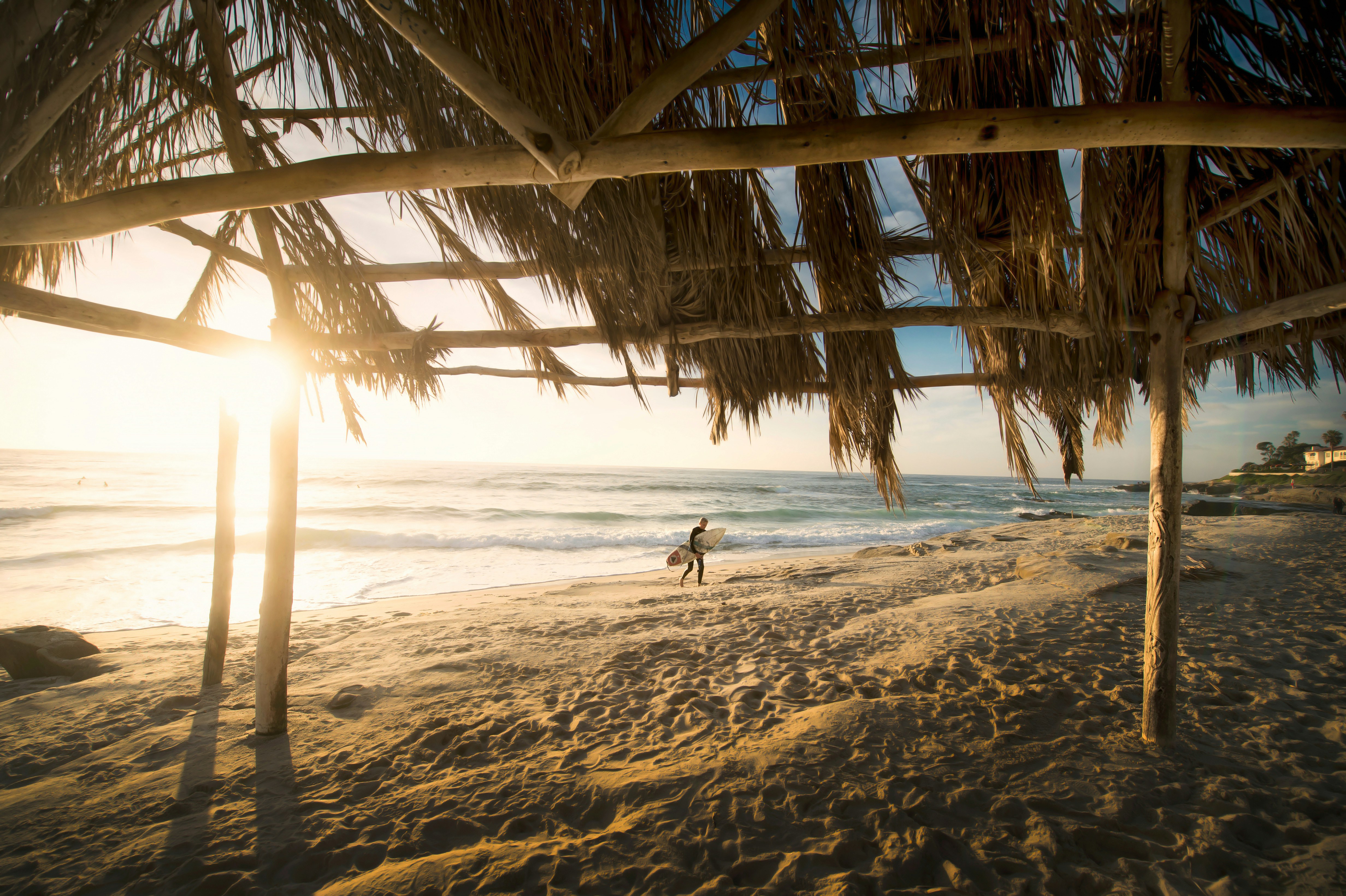 Surfer and beach hut