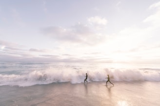 freedom running on beach sunrise