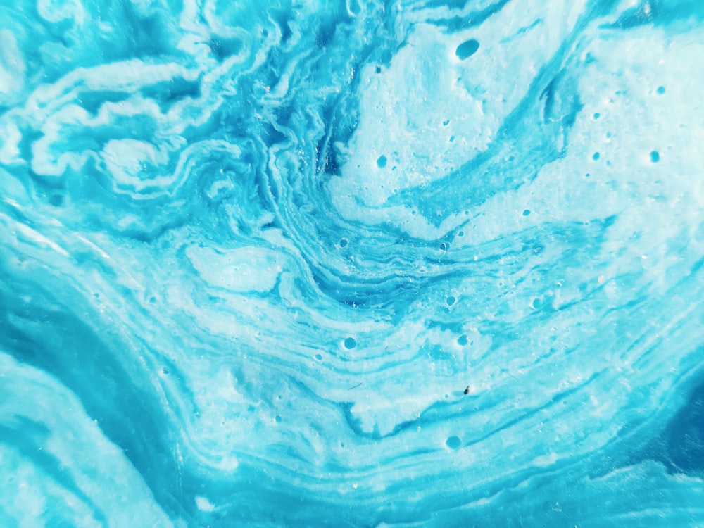 a close up view of a blue and white substance