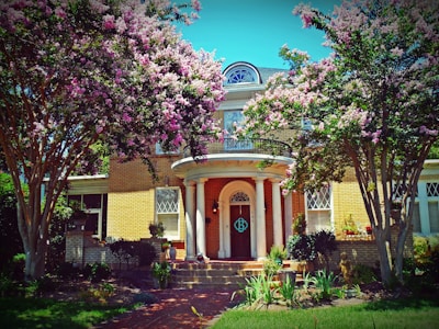 A charming historic home with lush landscaping.