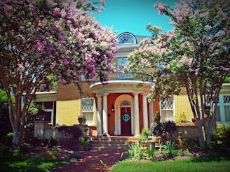A charming historic home with lush landscaping.