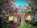A welcoming entrance to a charming guesthouse surrounded by blooming flowers.