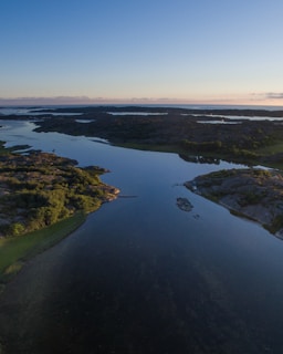 A serene landscape showcasing a filmmaker capturing nature's beauty.