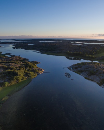 A serene landscape showcasing a filmmaker capturing nature's beauty.