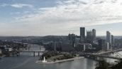 A city skyline view of Pittsburgh with rivers converging.