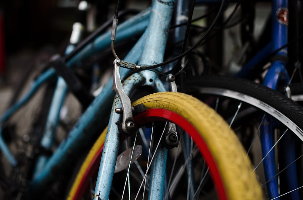 three blue bicycles