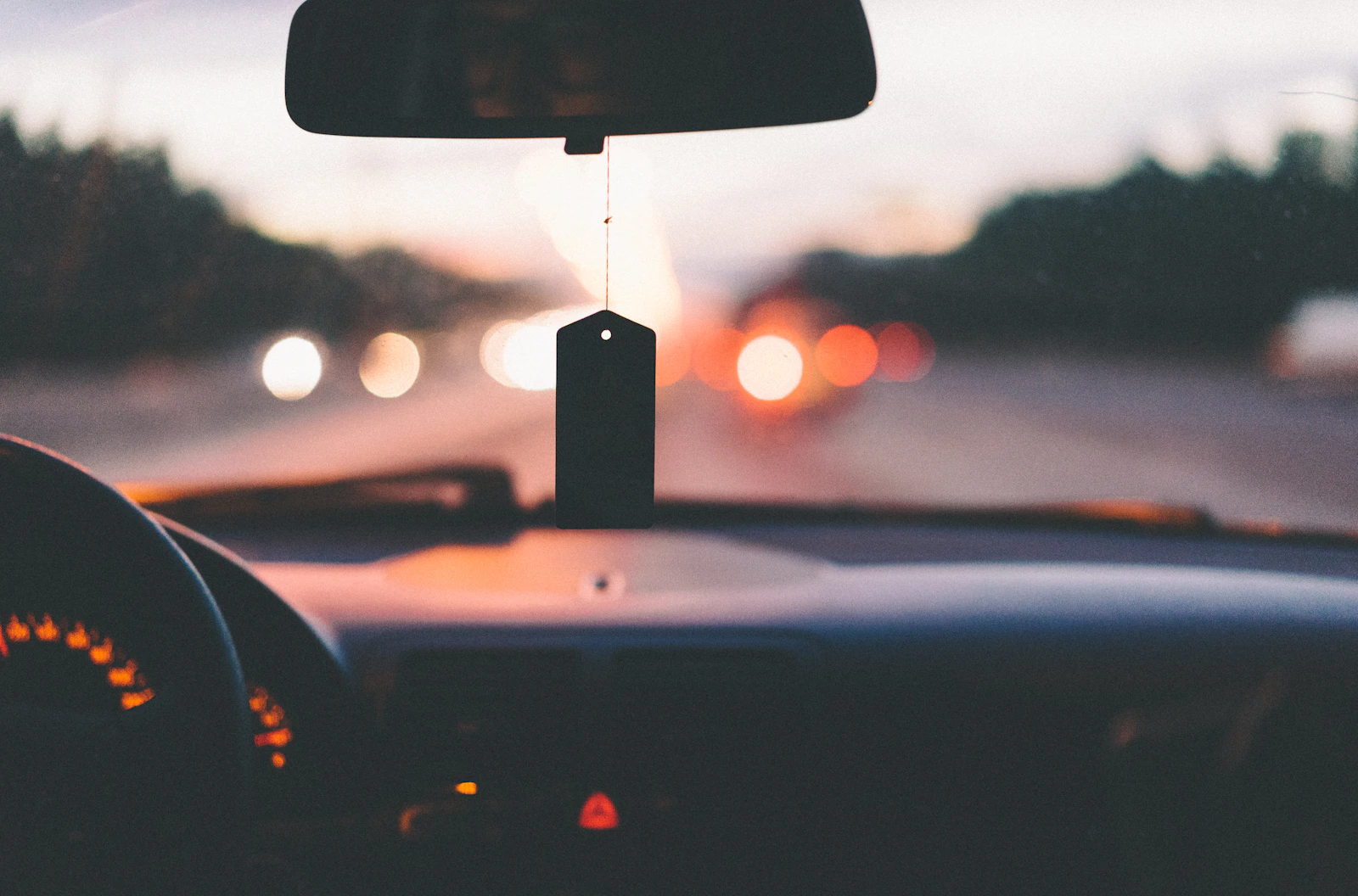 View from inside a car across the dashboard during a drive