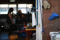 A workshop scene with tools and vinyl rolls visible, reflecting the careful craft behind each project.