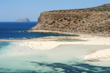 Sandy beach just a short walk from the hotel with calm turquoise waters.