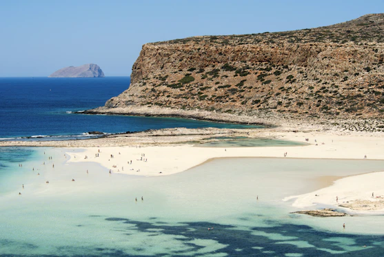Sandy beach just a short walk from the hotel with calm turquoise waters.