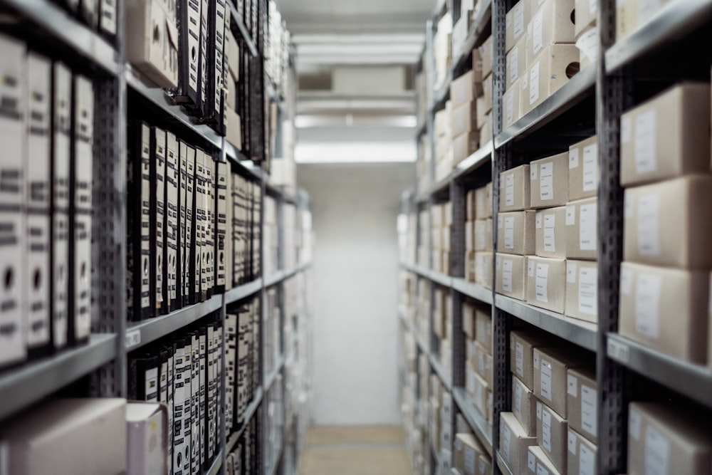 Binders and boxes on shelves in a large archive