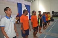 A group of handsome men rehearsing a scene together.