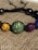 A close-up of a colorful stainless steel bracelet adorned with various textures.