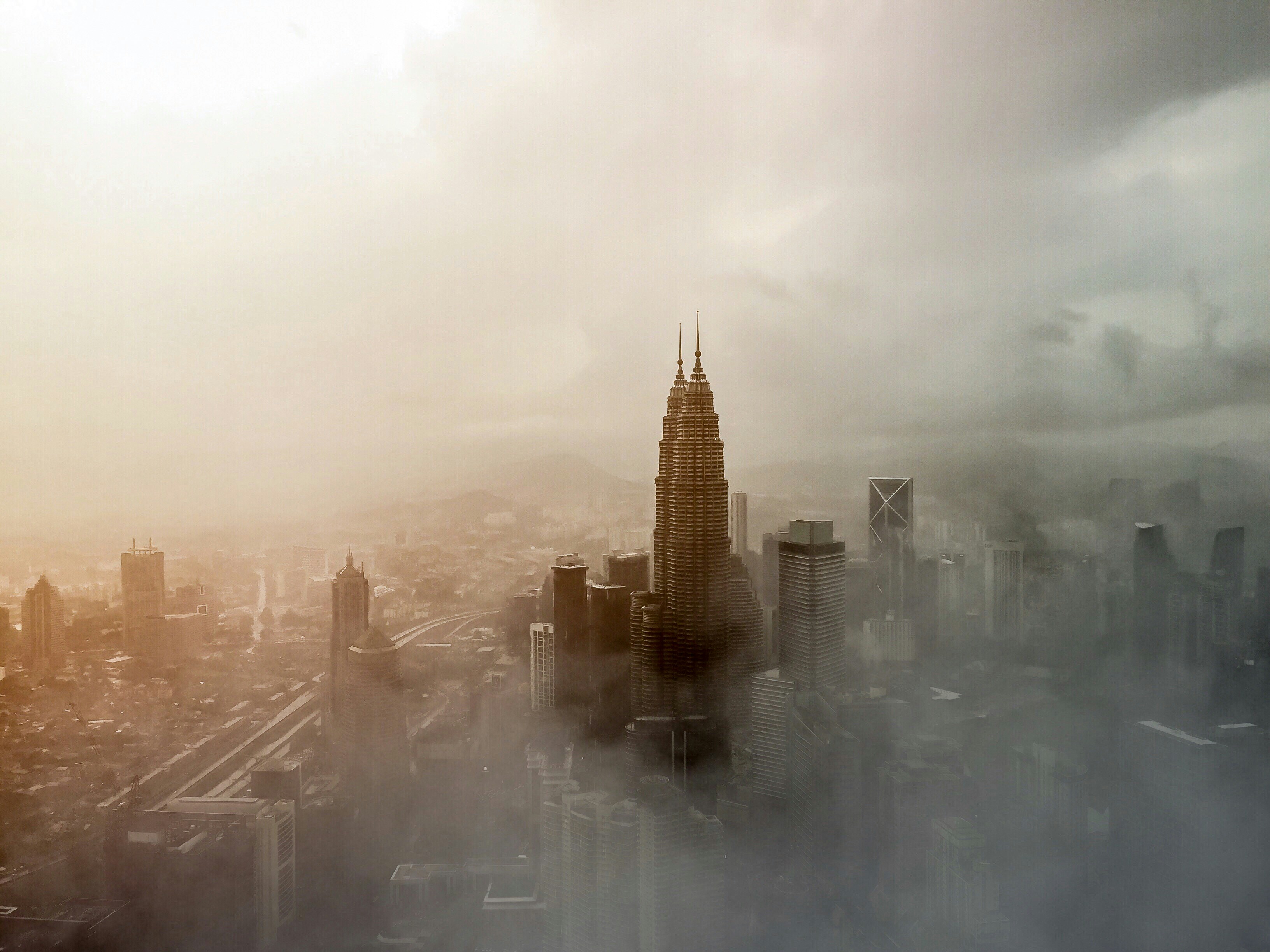 I was at KL tower and from there the view was so amazing with the haze surrounding the tall skyscrapers, sky covered with stormy clouds lighting up with the rays of setting sun.