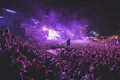 Concert crowd under purple lights