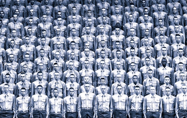 A group of professionals wearing matching uniforms in a corporate setting.