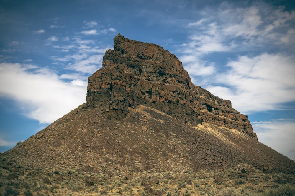 brown rocky mountain under blue sky during daytime