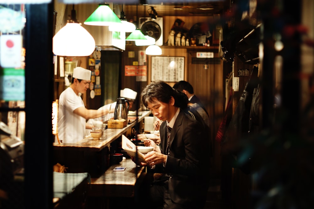 A man sitting at the counter at a Ramen restaurant in Shinjuku