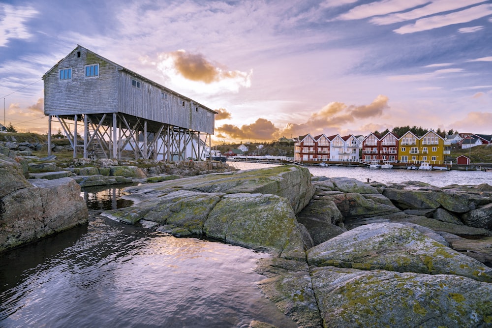 assorted houses near body of water during daytime