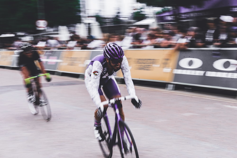 two men bike racing during daytime