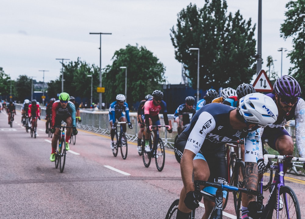 group of men riding bicycles