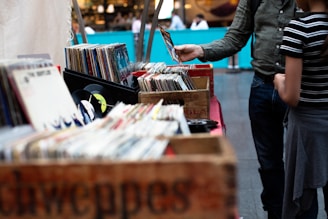 men standing in front of vinyl record sale