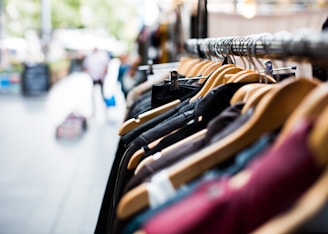 selective focus photography of hanged clothes