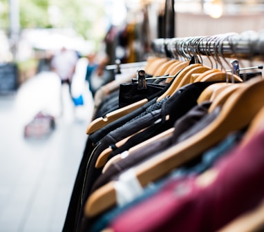 selective focus photography of hanged clothes