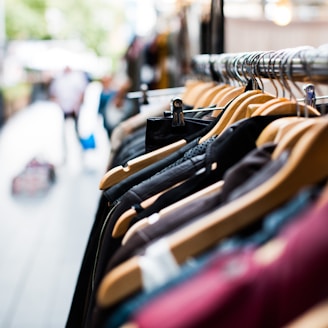 selective focus photography of hanged clothes