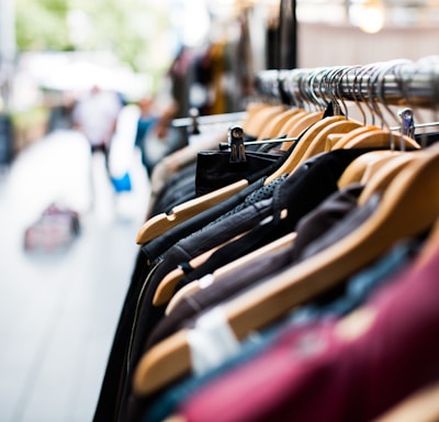 selective focus photography of hanged clothes