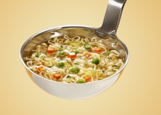 silver steel scoop with noodles