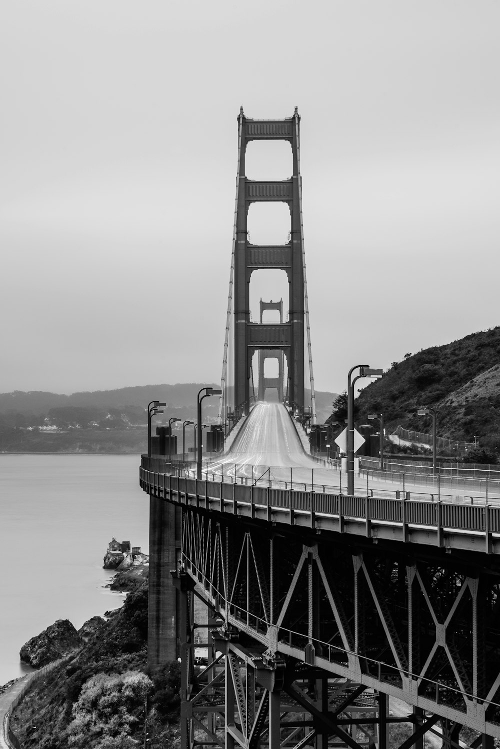 grascale photography of cable bridge