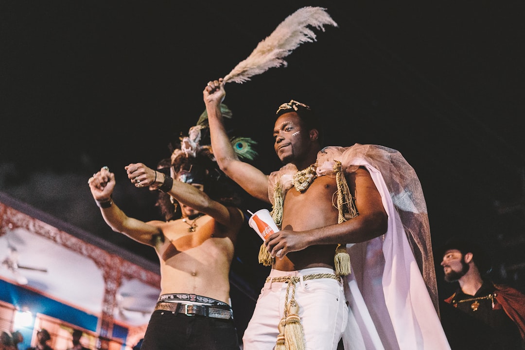 two topless men performing
