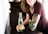 candid photography of woman holding bottle with broad smile