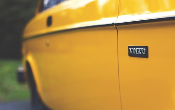 close up photography of yellow Volvo car