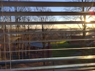 A scenic view from inside a box blind during sunset.