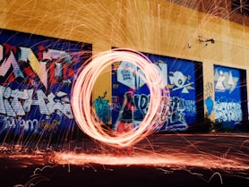 time-lapse photography of woman using steel wool