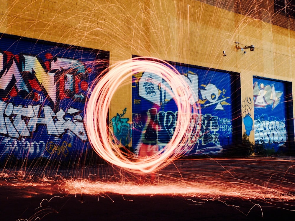 time-lapse photography of woman using steel wool